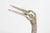 A striking and highly decorative pair of monumental crane sculptures, executed in silvered metal—likely silvered bronze or...