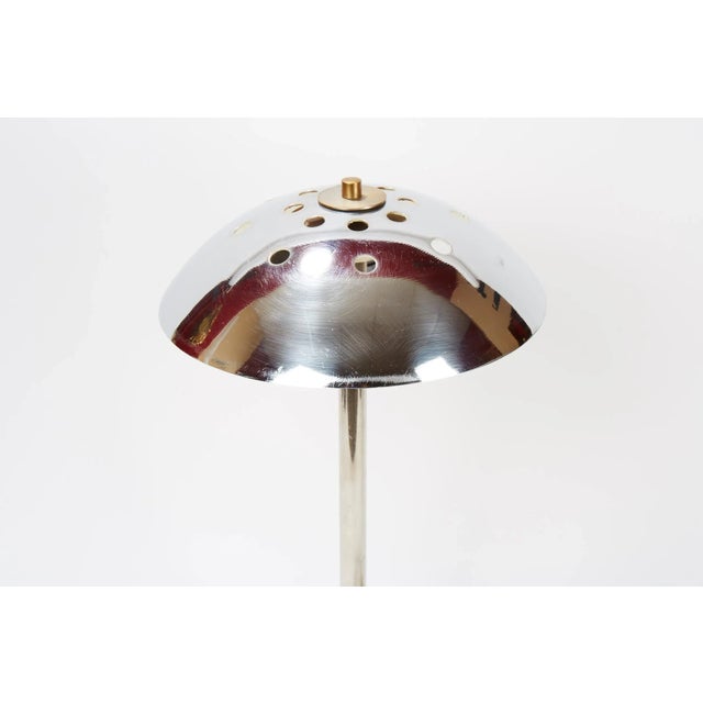 - A table lamp from Scandinavia - Most likely from the 1940s - The lamp is made of chromed metal with a brass screw which...