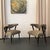 This pair of chic Hollywood Regency armchairs circa the 1950s strike a sophisticated pose from every angle. The pair...