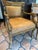 Old pair of empire style camel colored leather chairs. Nail head trim, distressed carved frames, dolphin carved arms. Deep...