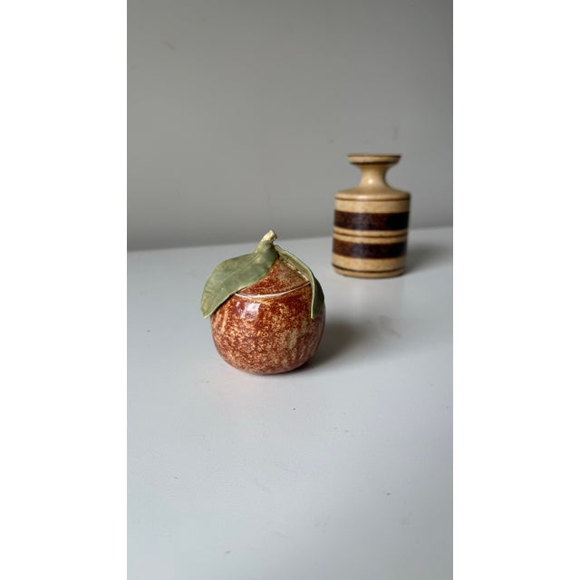 Vintage studio art pottery mottled peach. The piece is adorable in stature with glossy mottled finish, and matte leaves.