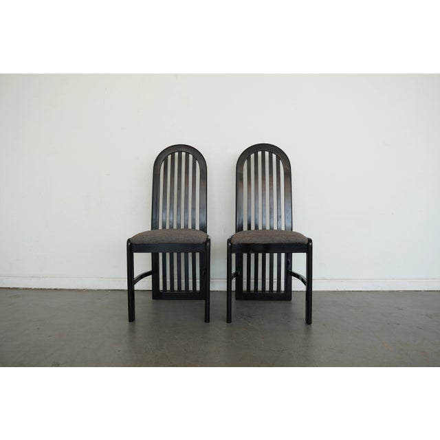 A striking set of four dining chairs by Pallavisini of Italy, showcasing the bold, sculptural lines typical of late 20th-...