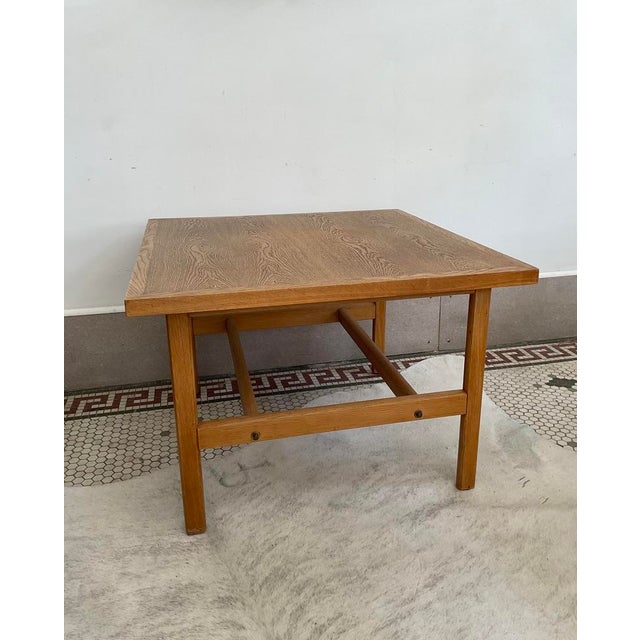 Elevate your interior with a masterpiece of mid-century Scandinavian minimalism—an authentic 1965 Danish oak side table...