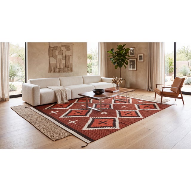 Elevate high-end interiors with this hand-woven modern Navajo-style wool rug, featuring a bold geometric lattice of...
