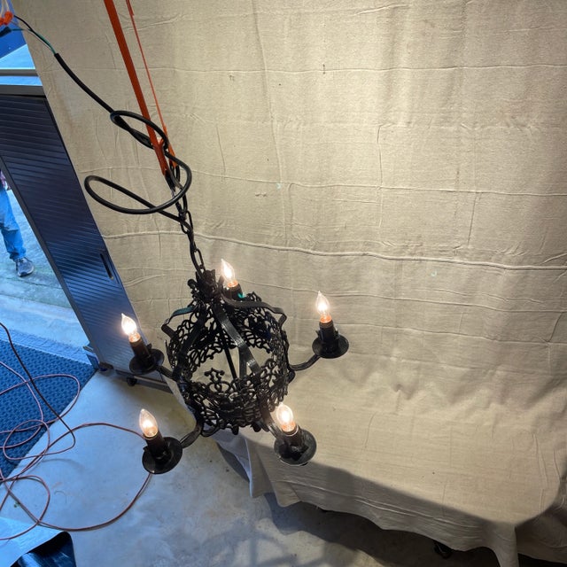 Very unique wrought iron chandelier, with pierced scroll decoration, and sailing clipper ships on each panel. 5 arms with...