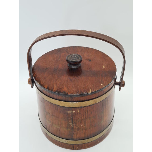 An original wooden cookie jar, made by basketville in putney, vermont, usa. the item has a distinctive cylindrical barrel...