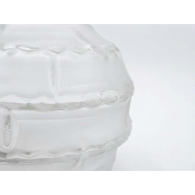 A rare spherical vase by andré hunebelle, made of molded pressed glass, dating from the art deco period, circa 1928-1930....