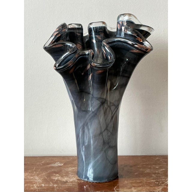 Discover the exquisite artistry of this vintage Italian Murano glass ruffle vase, a stunning example of mid-century modern...