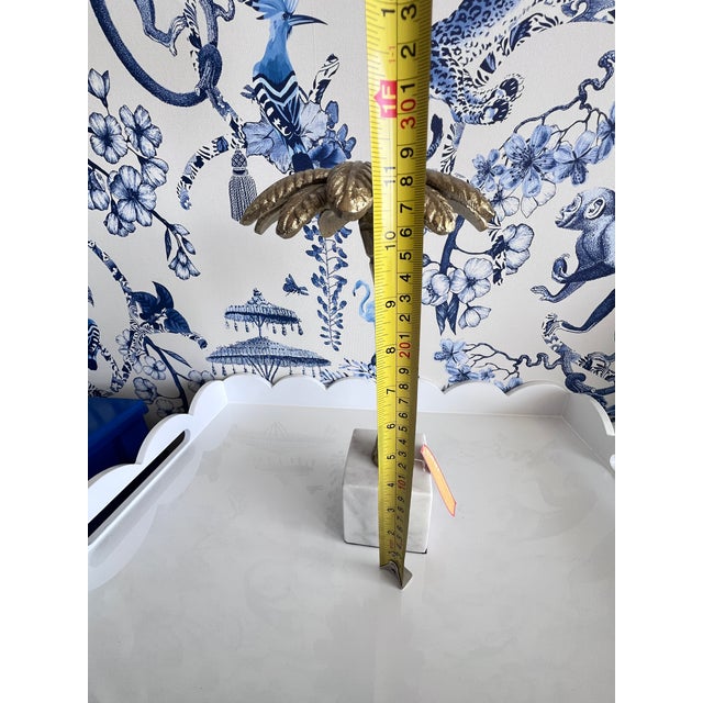 This Gold Brass Metal Palm Tree Alabaster Marble Block sculpture is a medium-sized piece with a tropical pattern, perfect...
