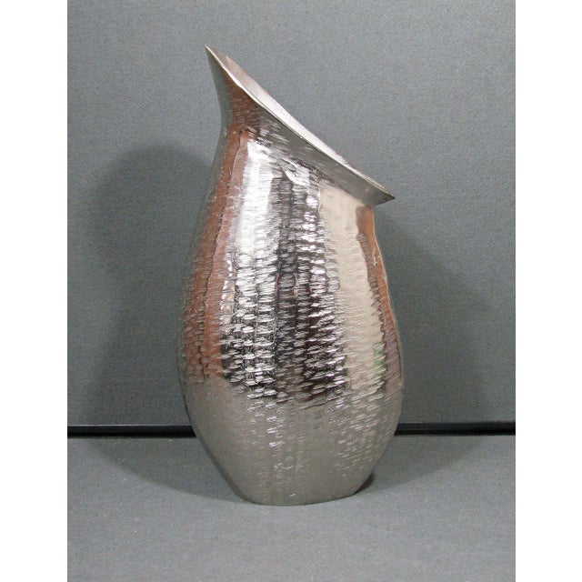 This large sculptural vase has the kind of quiet drama that instantly elevates a room. With its softly asymmetrical mouth,...