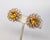 1950s goldtone openwork with prong set round faux-citrine center flower clip earrings. Marked "Napier" in the dip of the...
