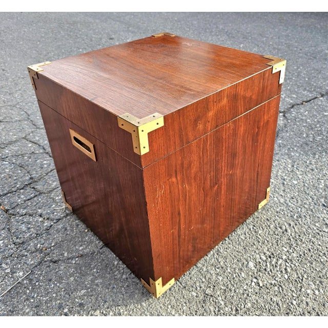 A very unique Pair of Mid Century Teak Campaign Style Cubical Side Tables Chests. Measure 17" in width, 17" in depth and...