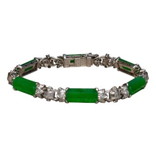 The Pulsera: Outstanding Signed Imperial Fei Cui Jadeite A Jade Bracelet set with Diamonds