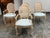 Design Plus Gallery presents a set of four French Louis XVI Style Cane-Back Armchairs. These chairs showcase oval-shaped...