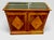 A handsome French commode à vantaux et tiroirs, having a rectangular case surmounted by an inset slab of black Belgian...