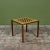 Square game table in the style of Gordon & Jane Martz. The table top is inlaid with yellow ceramic tiles with a...