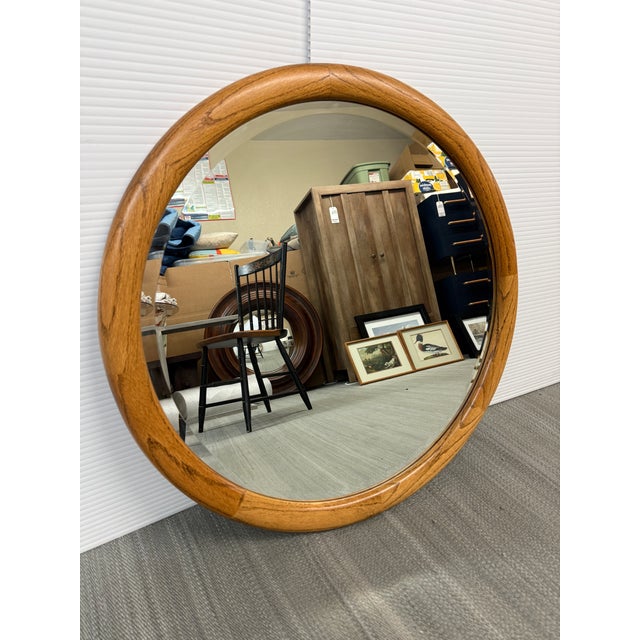 Design Plus Gallery presents a Vintage Round Oak Framed Wall Mirror. This round oak wood wall mirror brings warmth and...