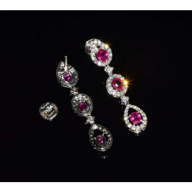 Gorgeous GIA certified 3.99CTS natural Burma ruby and diamond 18K solid white gold dangle earrings. These elegant earrings...