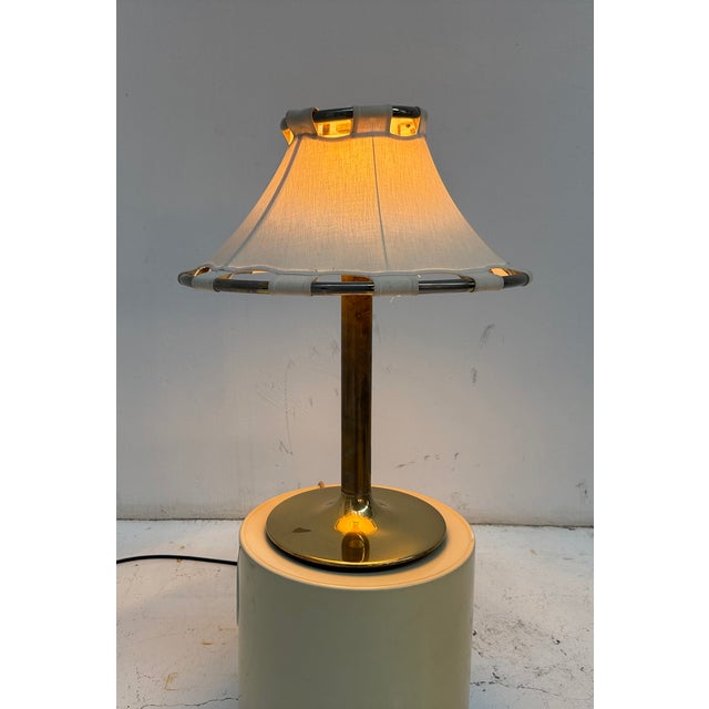 Beautiful large table lamp, featuring a brass base and a cream colored canvas shade. Carries one E27 light bulb. I have...
