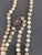 Unusually long antique single strand necklace with ornate sterling silver clasp. The clasp is of Victorian detail, the...
