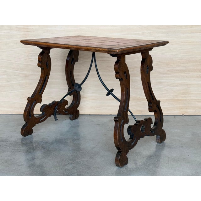 19th century Baroque Spanish side table with marquetry top 19th century Spanish trestle table in walnut. This piece has a...