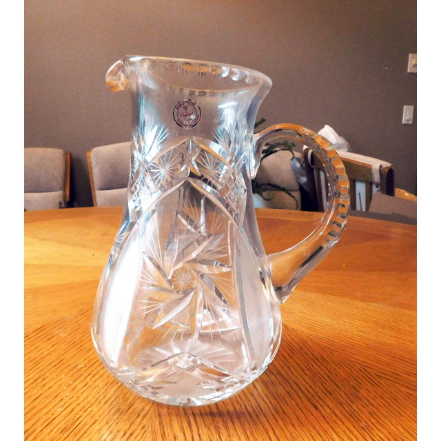 This is a very large crystal pitcher from Poland. It is from Crystal Clear of Poland as shown. The pitcher measures 9.50...