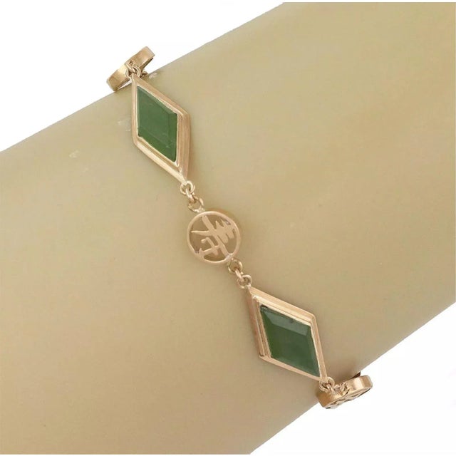 Material: 14k yellow gold Gemstone: jade Measurement: 6" long x 0.40" wide x 0.14" high Weight: 9.3 grams This is a lovely...
