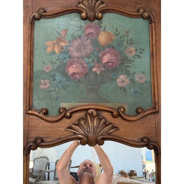19th century French louis xvi carved and parcel gilt trumeau mirror solid Oak with a hand painting in the top Circa 1850....