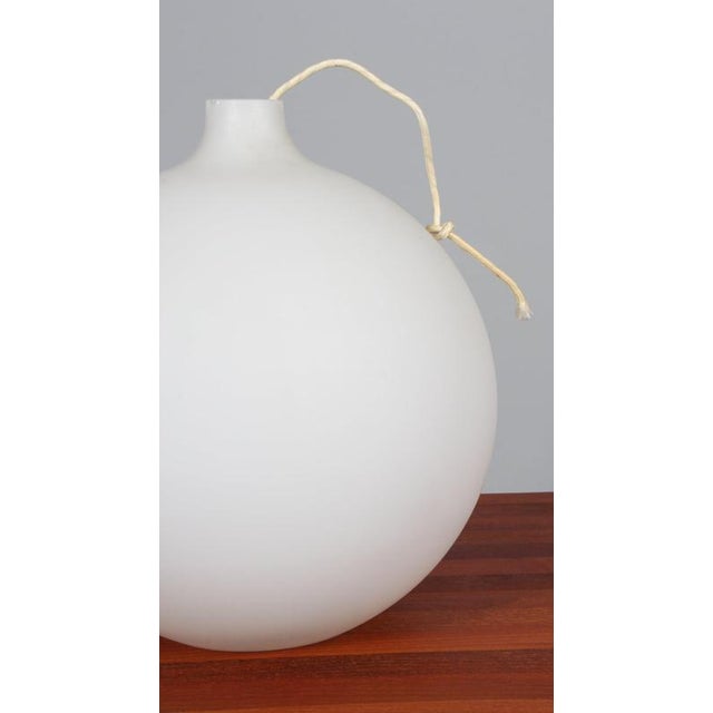 Vilhelm Wohlert for Louis Poulsen, 'Satellit' pendant, opaline glass, brass, Denmark, 1959. This simplistic, large frosted...