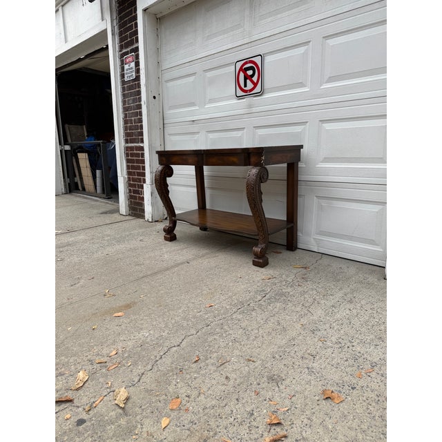 Traditional Vintage Neoclassical Revival Console Table With Ornately Carved Scroll Supports and Lower Shelf For Sale - Image 3 of 12