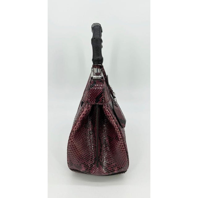 Gucci Purple Python Lady Lock Bag in excellent condition. Purple python snake skin exterior trimmed with a painted black...