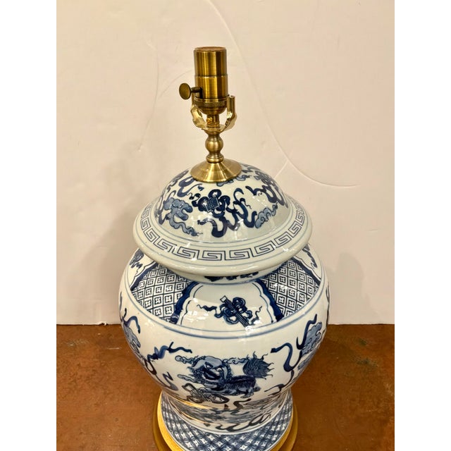 Asian Style Large Porcelain General Jar Lamp. Blue & white Glaze, gold base. Showroom floor sample.