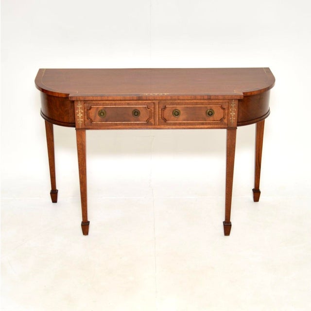 An impressive antique inlaid brass console table. It is in the Regency style, it was made in England and dates from around...