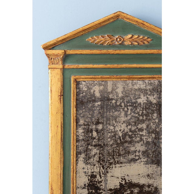 Height: 70 cm Width: 44 cm Some wear to gilding and paint, commensurate with age. Original mirror plate and backing.
