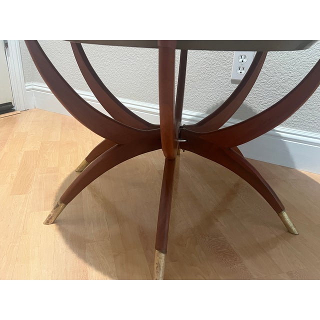 Sharp Hand carved Asian Motif Brass Top Round cocktail table. There is a glass insert that sits within the inner edge of...