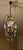 Crystal chandelier from around 1940, with a cage structure made of hot-shaped square-section brass tubing. The structure...