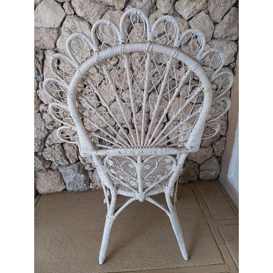 Vintage white wicker and rattan Sweetheart Fiddlehead Peacock Chair Style: Coastal Color: White Dimensions: 24" W x 47" H...