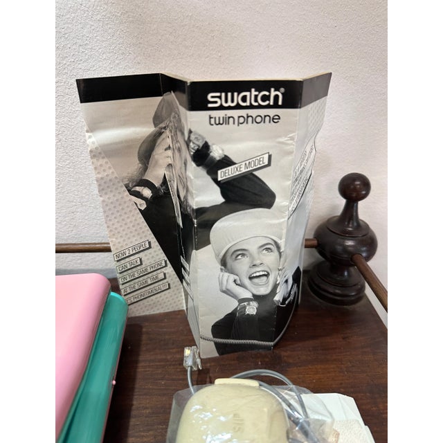 Twin Phone 2 Swatch phone in 1. years 80s. Working, complete with original box, power cord, guarantee and instruction...