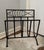 Whimsical mid-century French Modern magazine rack crafted from solid wrought iron, or fer forgé, with a sculptural fish...