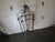 This French style inside/outside lantern showcases the timeless artistry of wrought iron craftsmanship. It's intricate...