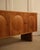 Geometric-style sideboard featuring three raised circular motifs on the doors. A fine example of cabinetmaking craftsmanship.