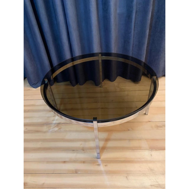 A large coffee table from the 1960s In original and very good condition. Thick, tempered and smoked glass. Glass thickness...