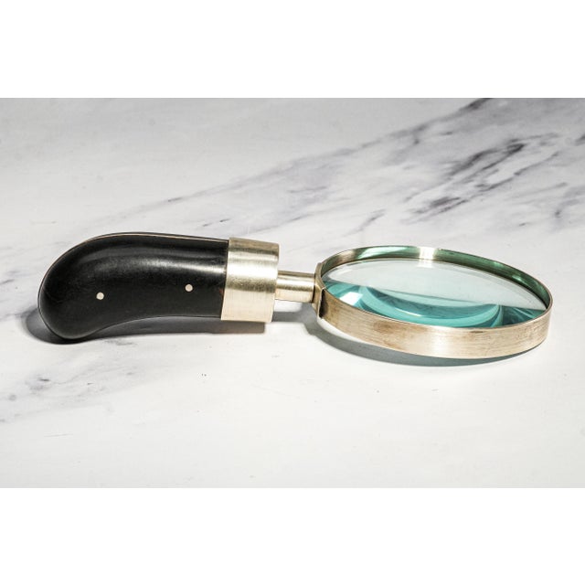 A striking example of Ralph Lauren Home's timeless design philosophy, this substantial 1990s sterling silver and wood...