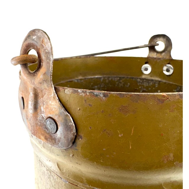 Originally produced as a Soviet military steel utility canister, this substantial olive drab vessel makes an exceptional...