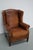 This cognac-colored leather club chair comes from the Netherlands. It is upholstered with cognac-colored leather and...