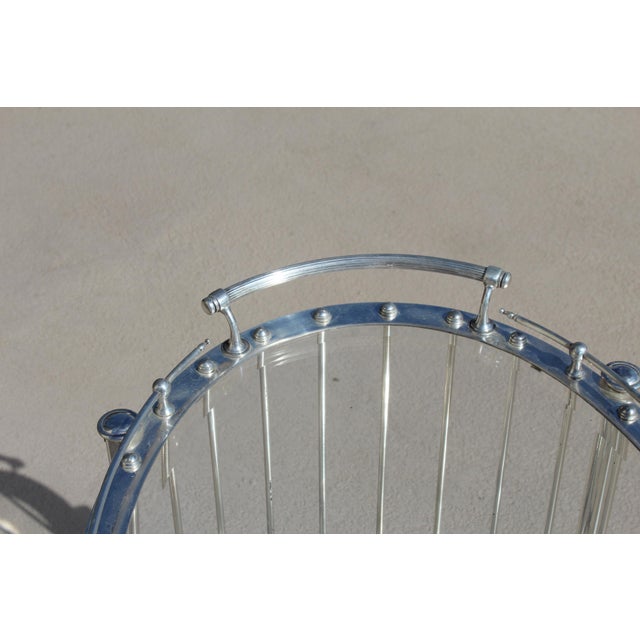 A great design of this Oval Bar Cart . It is Silver Plated and has 3" dia wheels . Top shelf is glass with a 3/4" bevel ....