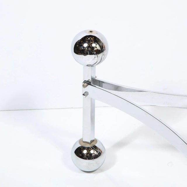 This stunning Mid-Century Modern cocktail table was realized in the United States circa 1970. It features three...