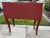 This nice piece features a sharp Red painted body with two doors and a Dark Brown Stained top. The ornate handles...