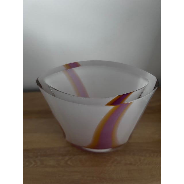 Rare and captivating rounded glass vase with a joyful streak of pink, orange, yellow wrapping around it. Bengt Edenfalk...