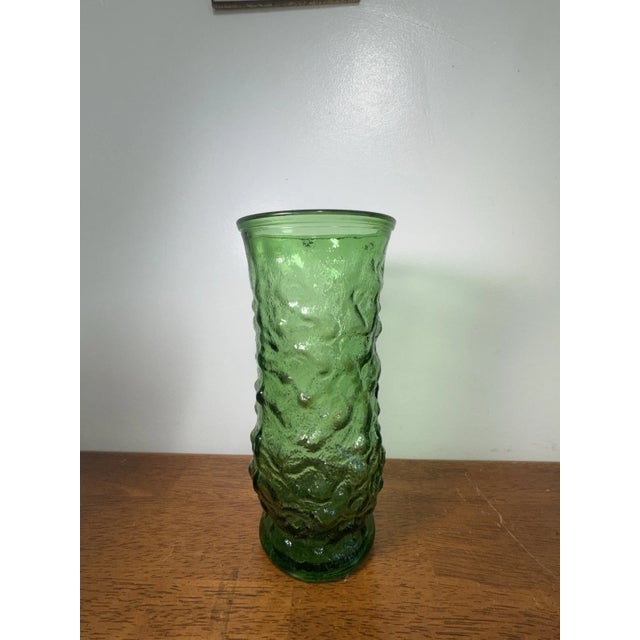 Vintage green art glass vase featuring a unique textured bark-style design. A beautiful retro decorative piece perfect for...